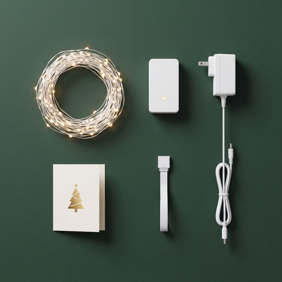 What is in the MerryGlow box: LED strands, smart controller, power adapter, connector cable and quick-start card